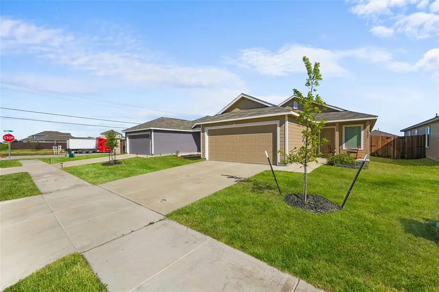 Front exterior of a new home in Eastland, Crandall, TX, highlighting curb appeal (Image 2). Front exterior of a new home in Eastland, Crandall, TX, highlighting curb appeal (Image 2).