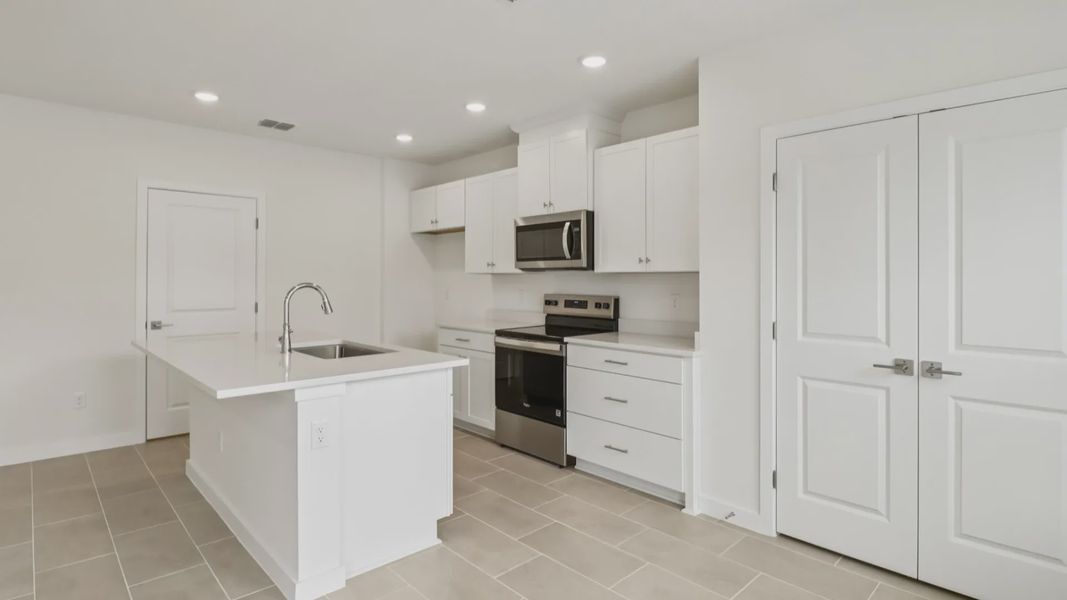 Furnished interior view inside a new home in Cyrene at Harmony, St. Cloud (Image 14).