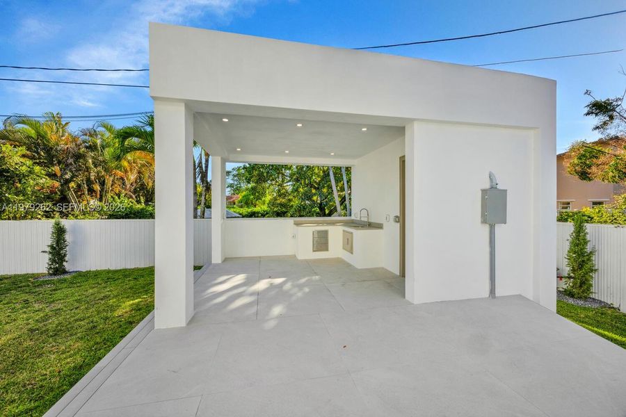 Exterior details and patio area of a home in , Miami Springs (Image 24).
