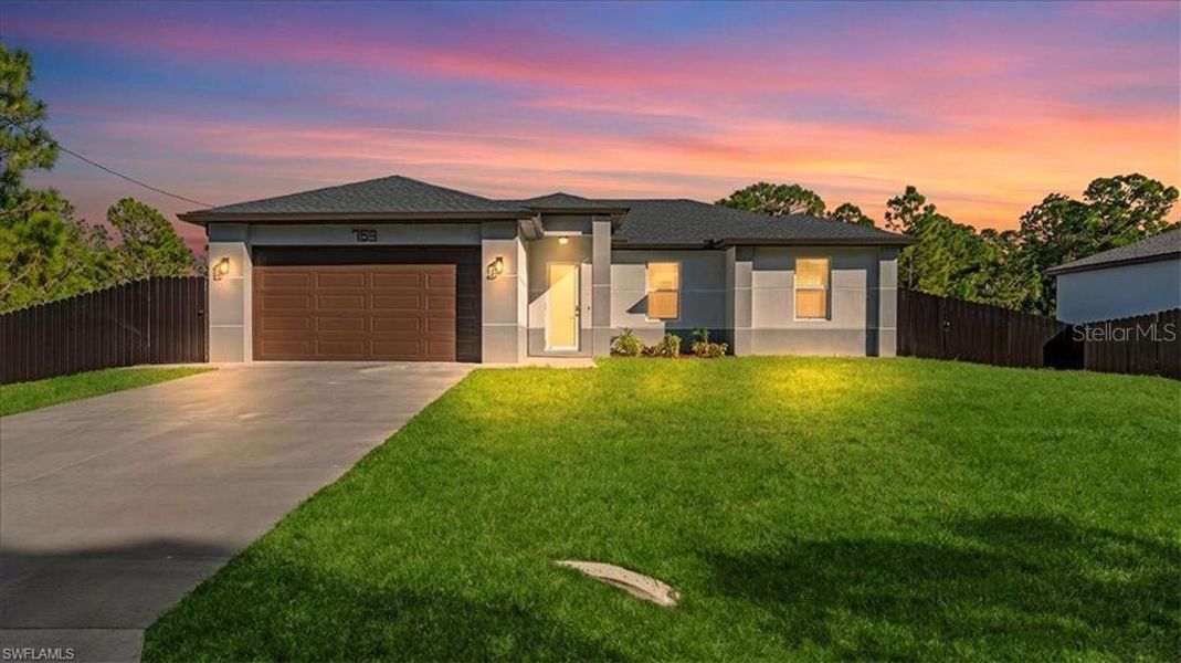 Front exterior of a new home in , Lehigh Acres, FL, highlighting curb appeal (Image 20).