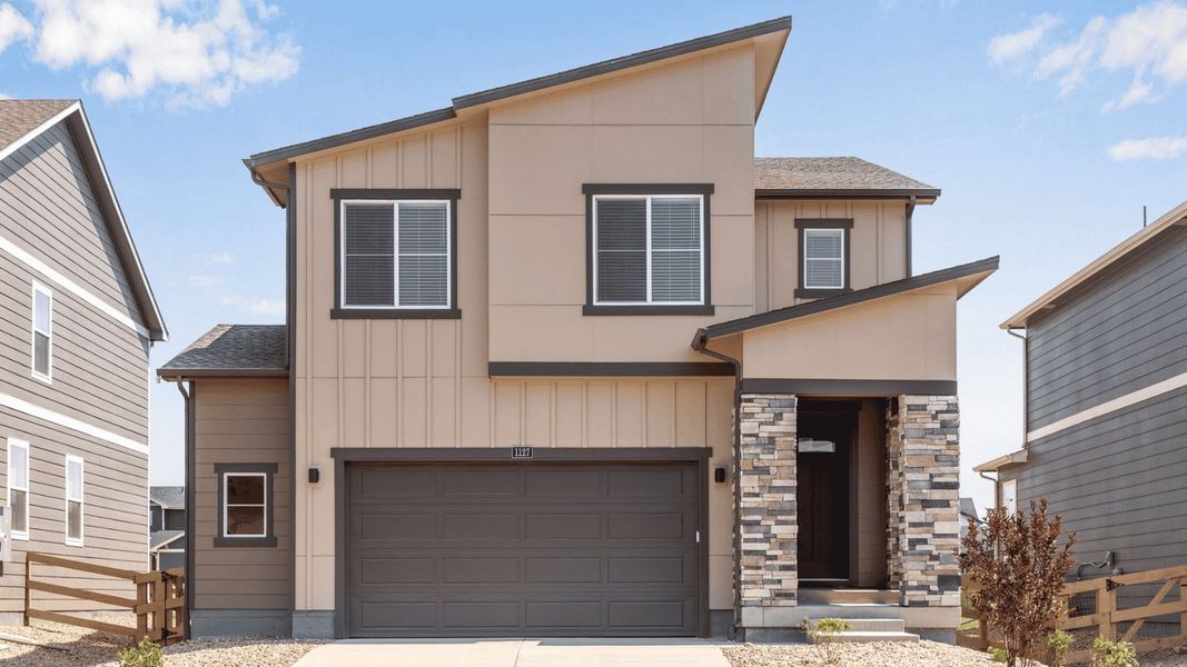 Front exterior of a new home in Prairie Song, Windsor, CO, highlighting curb appeal (Image 1). Front exterior of a new home in Prairie Song, Windsor, CO, highlighting curb appeal (Image 1).