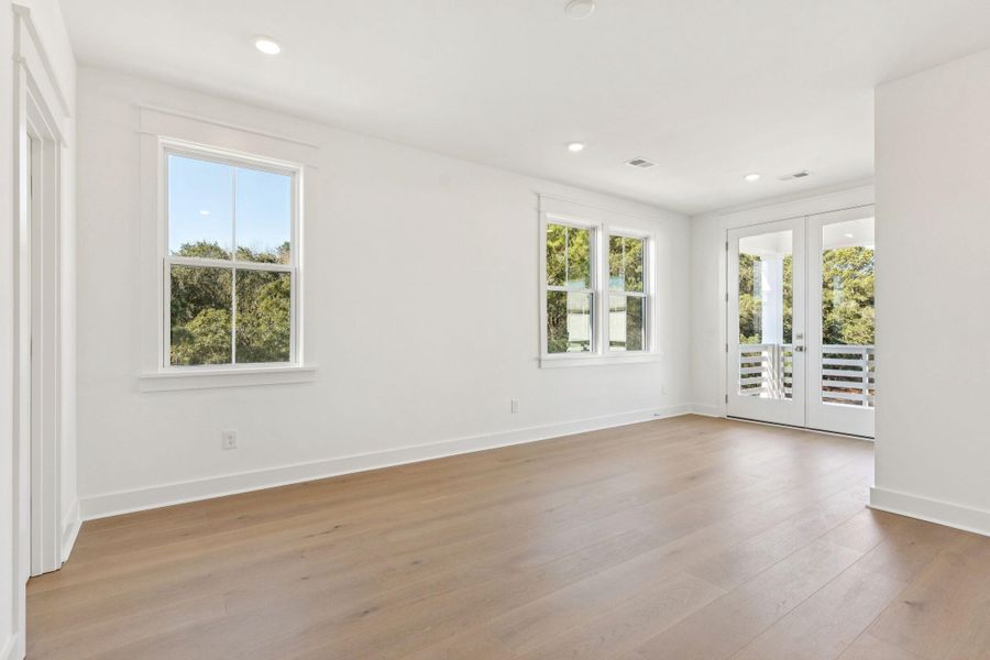 Spacious, unfurnished interior of a new home in Overlook at Copahee Sound, Awendaw (Image 64).