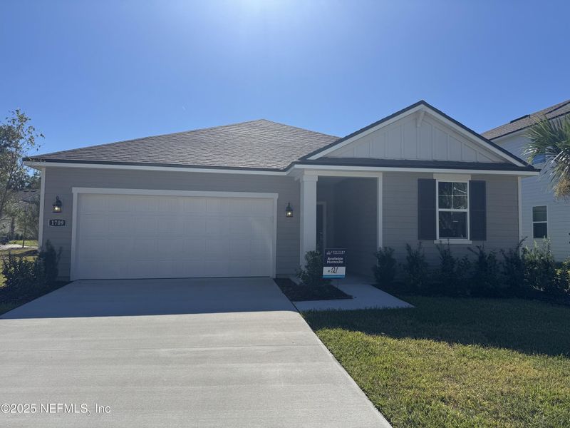 Front exterior of a new home in Oak Creek Preserve, Jacksonville, FL, highlighting curb appeal (Image 1). Front exterior of a new home in Oak Creek Preserve, Jacksonville, FL, highlighting curb appeal (Image 1).