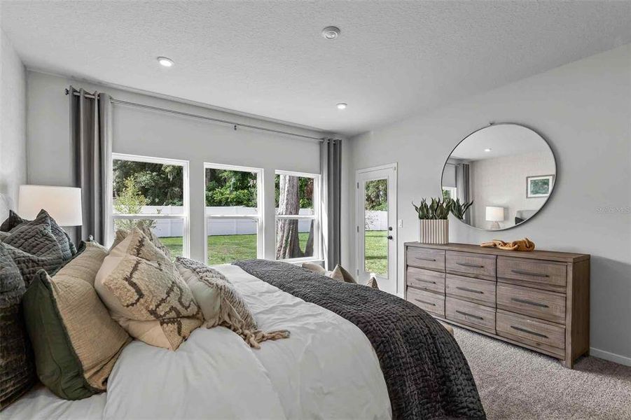 Furnished interior view inside a new home in The Cypress Series at Reserve East, Flagler Beach (Image 7).