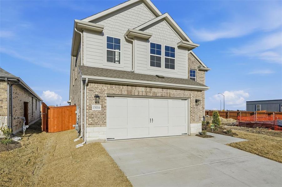 Front exterior of a new home in Morningstar, Aledo, TX, highlighting curb appeal (Image 25). Front exterior of a new home in Morningstar, Aledo, TX, highlighting curb appeal (Image 25).