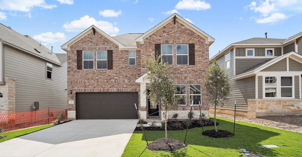 Representative exterior photo of a completed home built from the Blake by Ashton Woods in Rolling Glen, Hutto, TX (Image 31).