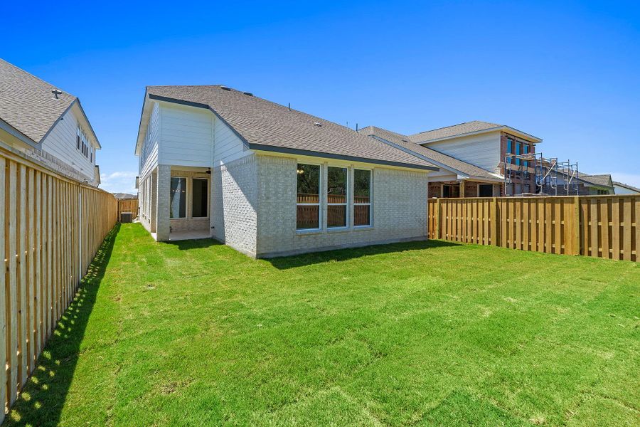 Exterior details and patio area of a home in Parmer Ranch, Georgetown (Image 24).