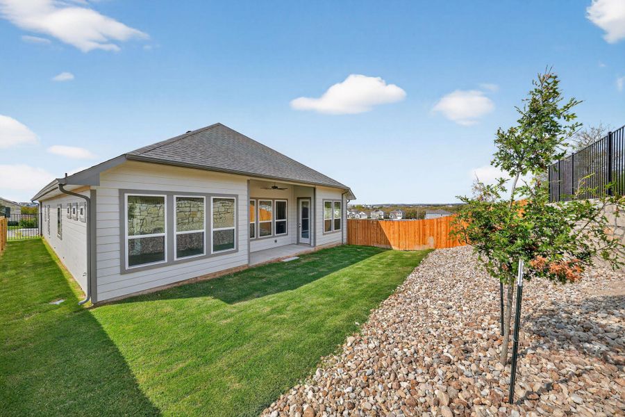Rear view of property featuring a patio, a fenced backyard, a ceiling fan, and a shingled roof Rear view of property featuring a patio, a fenced backyard, a ceiling fan, and a shingled roof