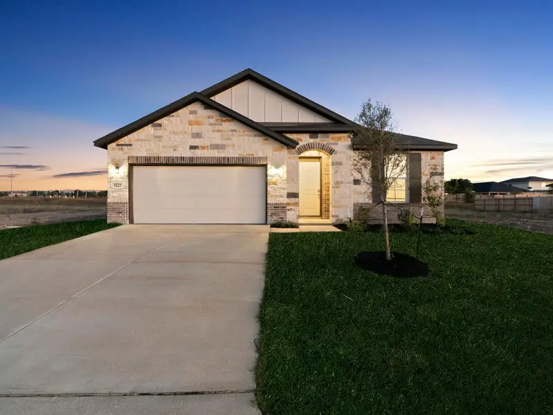 Front exterior of a new home in Weltner Farms, New Braunfels, TX, highlighting curb appeal (Image 1). Front exterior of a new home in Weltner Farms, New Braunfels, TX, highlighting curb appeal (Image 1).