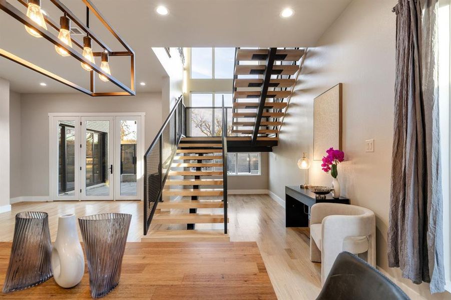 Staircase featuring wood-type flooring