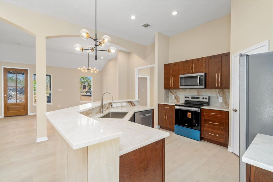 Sleek cabinetry and top-ofthe-line stainless steelappliances make this kitchena chef’s dream, marryingstyle with functionality.