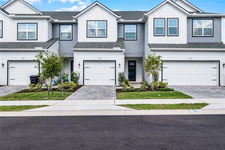 Front exterior of a new home in Brentwood Landing, Oviedo, FL, highlighting curb appeal (Image 21). Front exterior of a new home in Brentwood Landing, Oviedo, FL, highlighting curb appeal (Image 21).