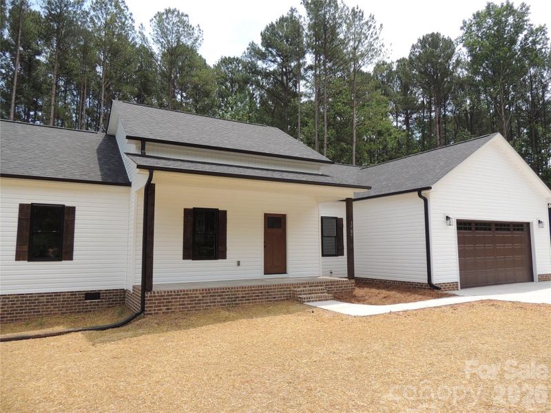 Front exterior of a new home in , Iron Station, NC, highlighting curb appeal (Image 2). Front exterior of a new home in , Iron Station, NC, highlighting curb appeal (Image 2).