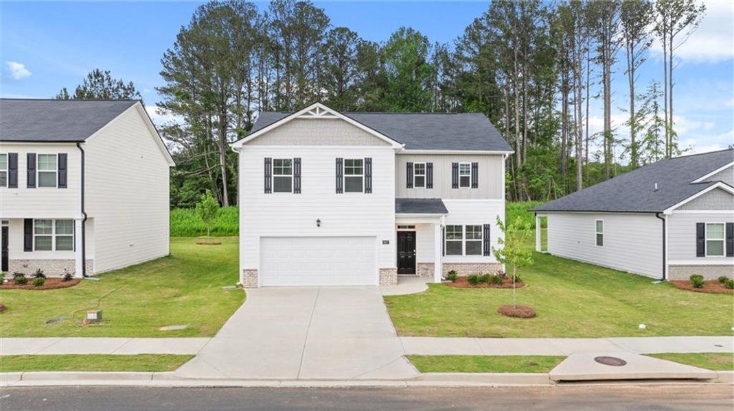 Front exterior of a new home in Champion's Run, Lithonia, GA, highlighting curb appeal (Image 17).