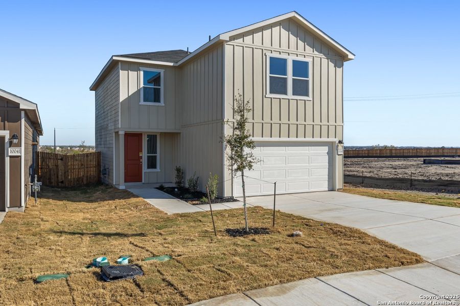 Front exterior of a new home in Punta Verde, Converse, TX, highlighting curb appeal (Image 1).