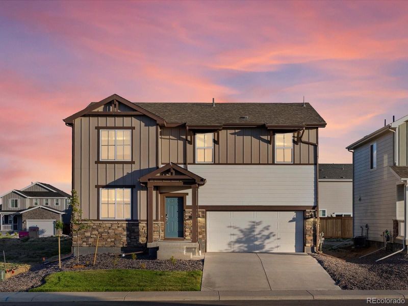 Front exterior of a new home in Revere at Johnstown, Johnstown, CO, highlighting curb appeal (Image 19).