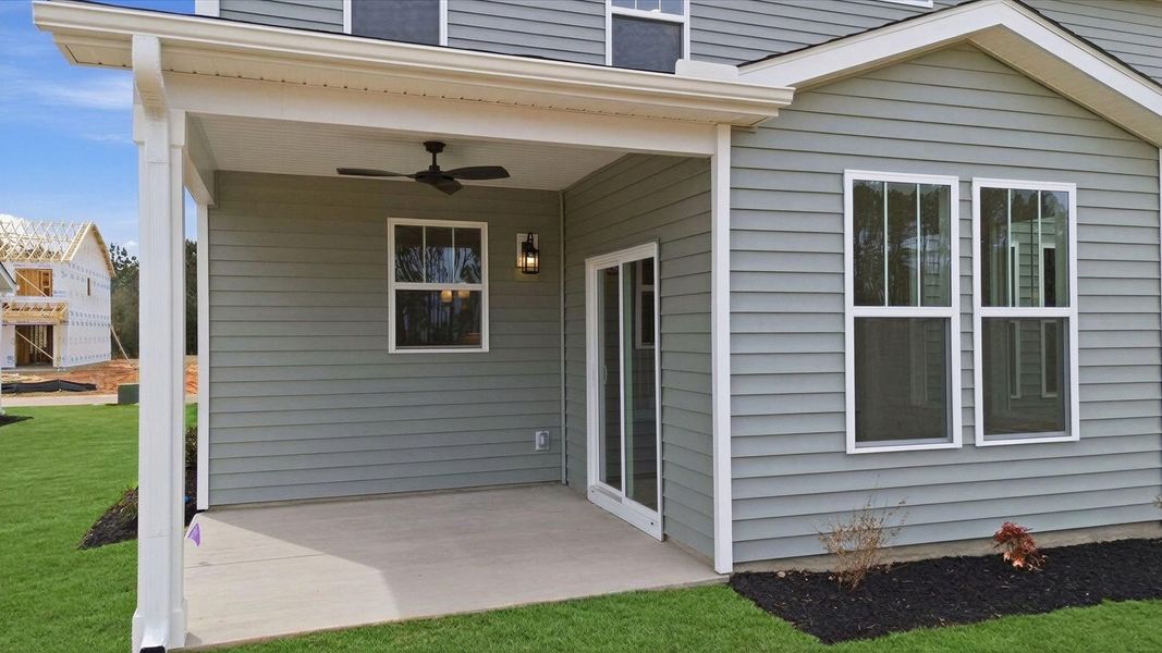 Established charm meets functional outdoor living with a spacious rear covered porch at the Foxbank community in SC