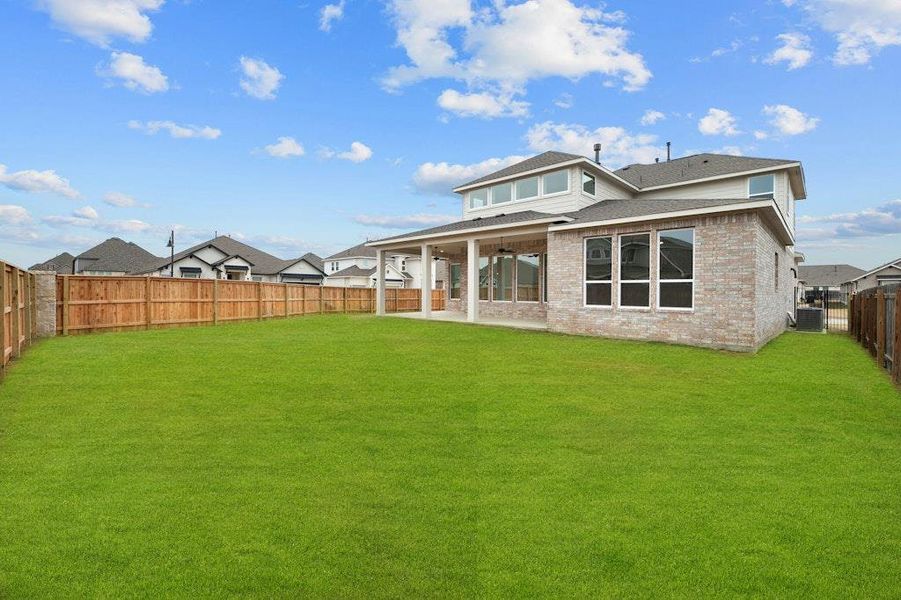 Front exterior of a new home in Santa Rita Ranch, Liberty Hill, TX, highlighting curb appeal (Image 16).