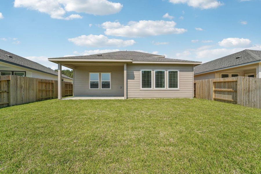 Front exterior of a new home in , New Caney, TX, highlighting curb appeal (Image 24).