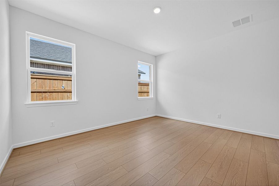 This another bedroom offers a bright and airy retreat with beautiful wood-look flooring and windows that fill the space with natural light. This another bedroom offers a bright and airy retreat with beautiful wood-look flooring and windows that fill the space with natural light.