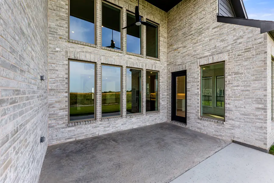 Representative exterior details of a home built from the 5042 by Tradition Homes in Lakewood at Brookhollow – 60′ Lots, Prosper (Image 4).