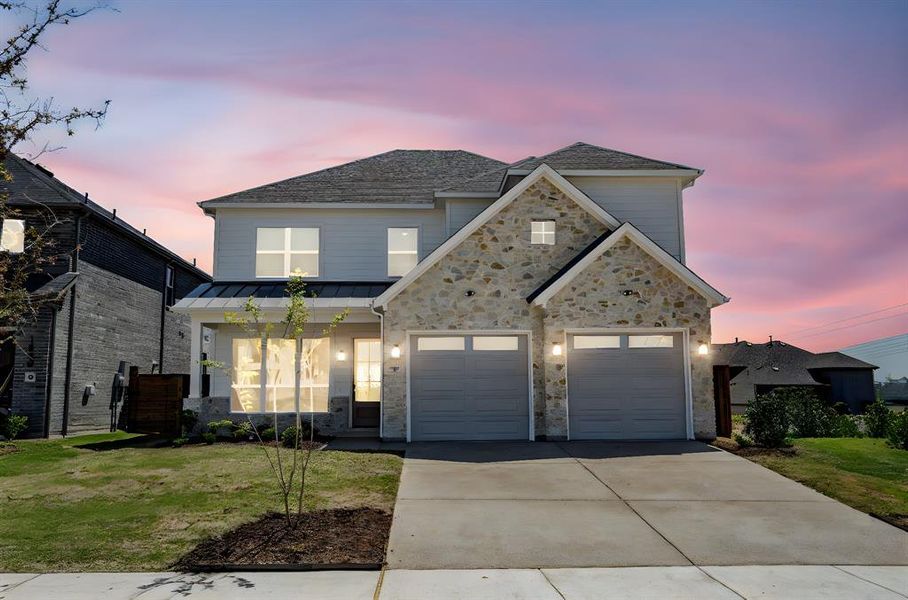Front exterior of a new home in Solterra, Mesquite, TX, highlighting curb appeal (Image 21). Front exterior of a new home in Solterra, Mesquite, TX, highlighting curb appeal (Image 21).