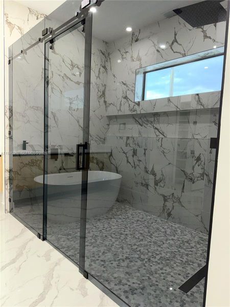 Master Bathroom, pure luxury glass doors , two showers and bath soak tub