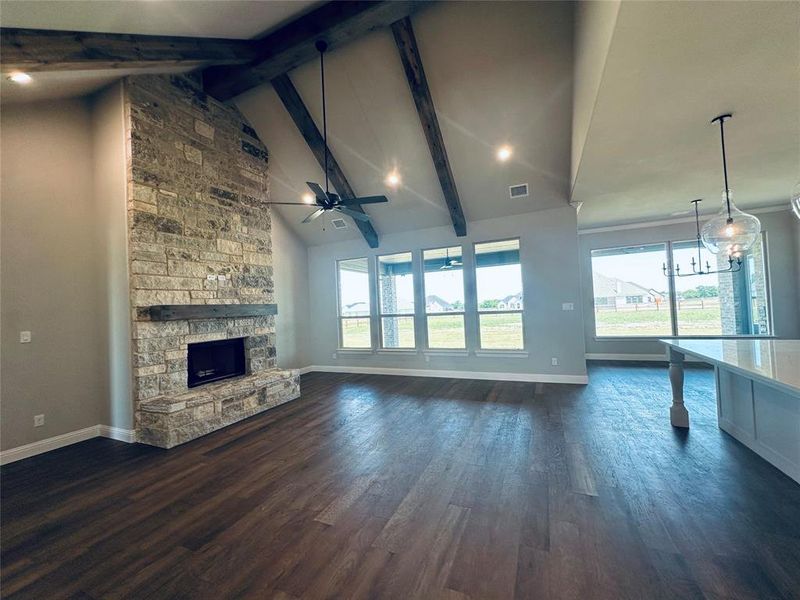 Living with fireplace and stained beams