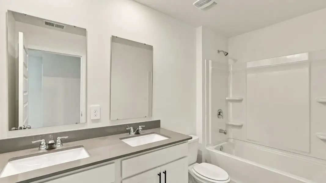Furnished interior view inside a new home in The Lakes at North Glynn, Brunswick (Image 11).