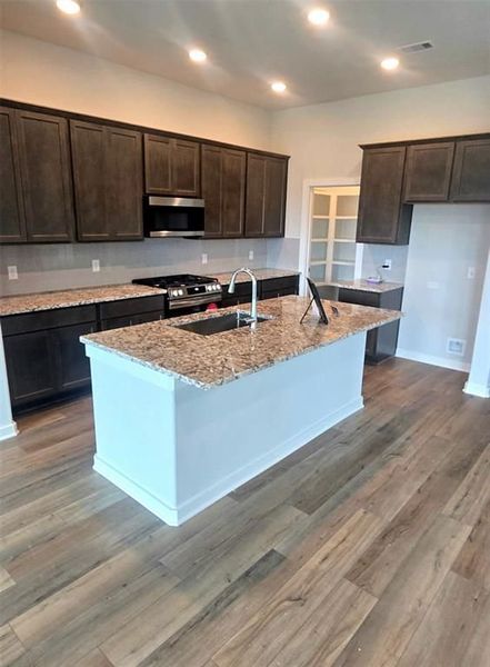 Furnished interior view inside a new home in Sunterra, Katy (Image 19).