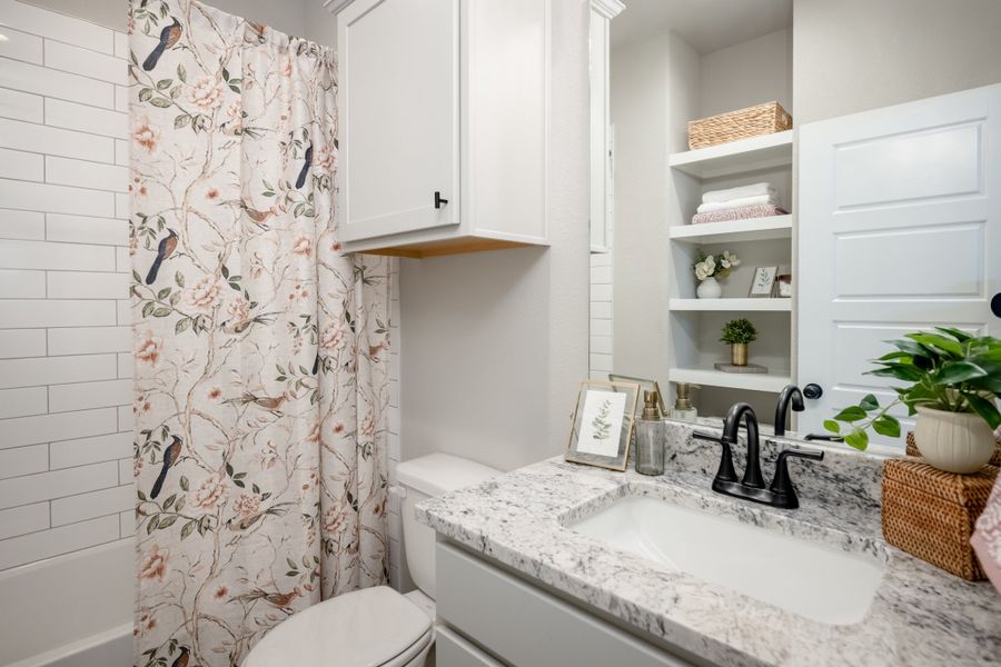Furnished interior view inside a new home in Greens Prairie Reserve, College Station (Image 30).