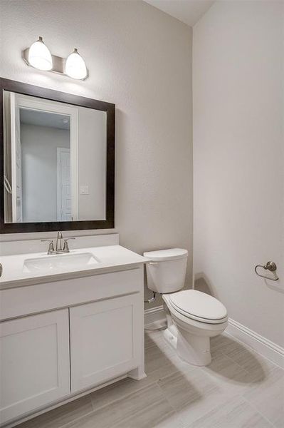 Bathroom with vanity and toilet