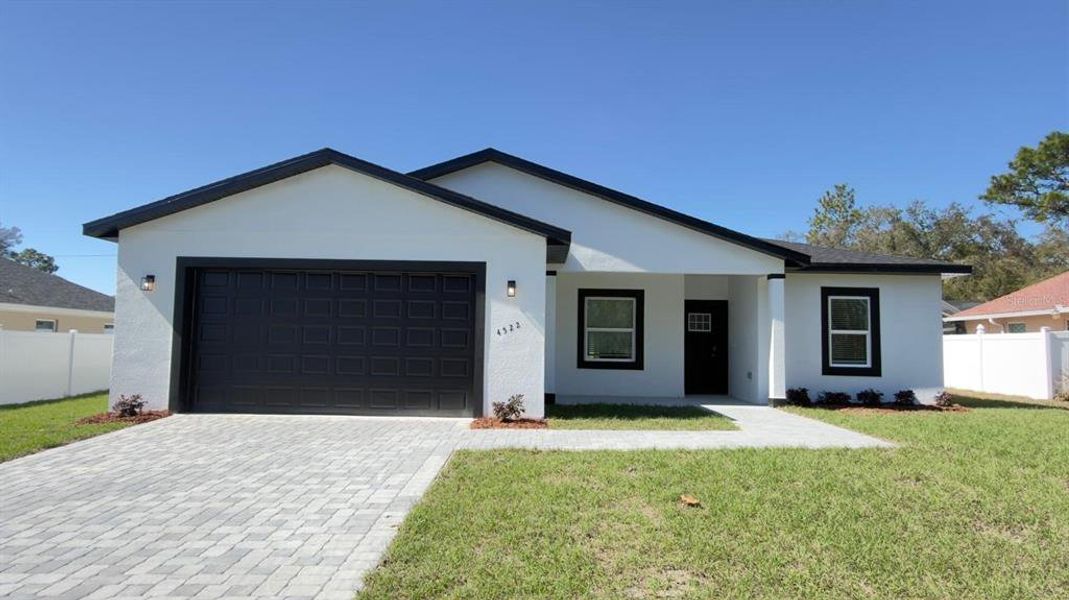 Front exterior of a new home in , Ocala, FL, highlighting curb appeal (Image 21).