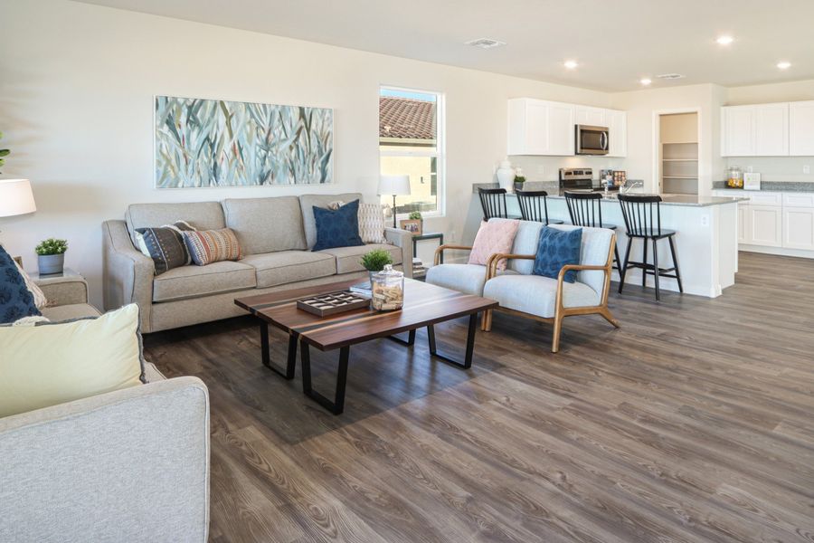 A living room with a wood floor. A living room with a wood floor.