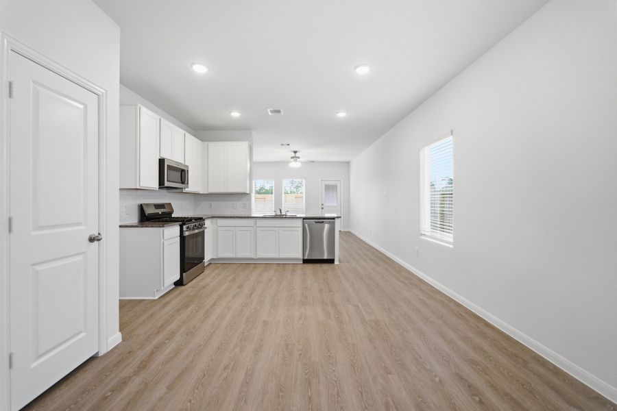 Furnished interior view inside a new home in The Pines at Seven Coves, Willis (Image 5).