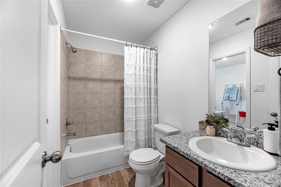 Upstairs bath with a tub/shower combo.