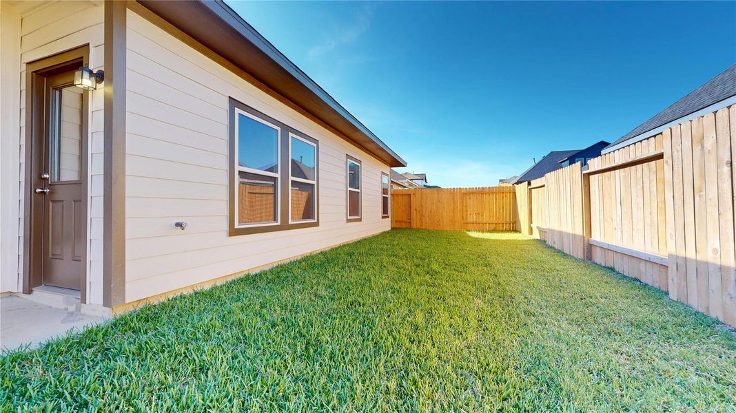 Exterior details and patio area of a home in Lexington Heights 50', Willis (Image 3).