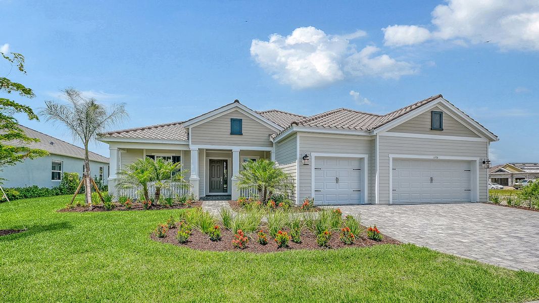 Front exterior of a new home in Grand Park Real Estate and Homes for Sale in Sarasota, FL - Neal Communities, Sarasota, FL, highlighting curb appeal (Image 1). Front exterior of a new home in Grand Park Real Estate and Homes for Sale in Sarasota, FL - Neal Communities, Sarasota, FL, highlighting curb appeal (Image 1).