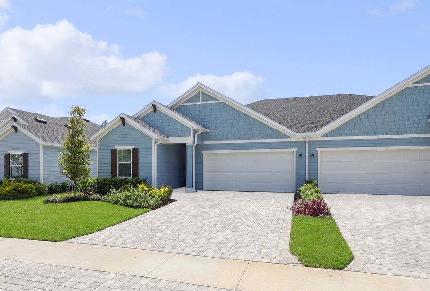 Front exterior of a new home in Stillwater | Active Adult 55+: Stillwater - Villas, St. Johns, FL, highlighting curb appeal (Image 1).