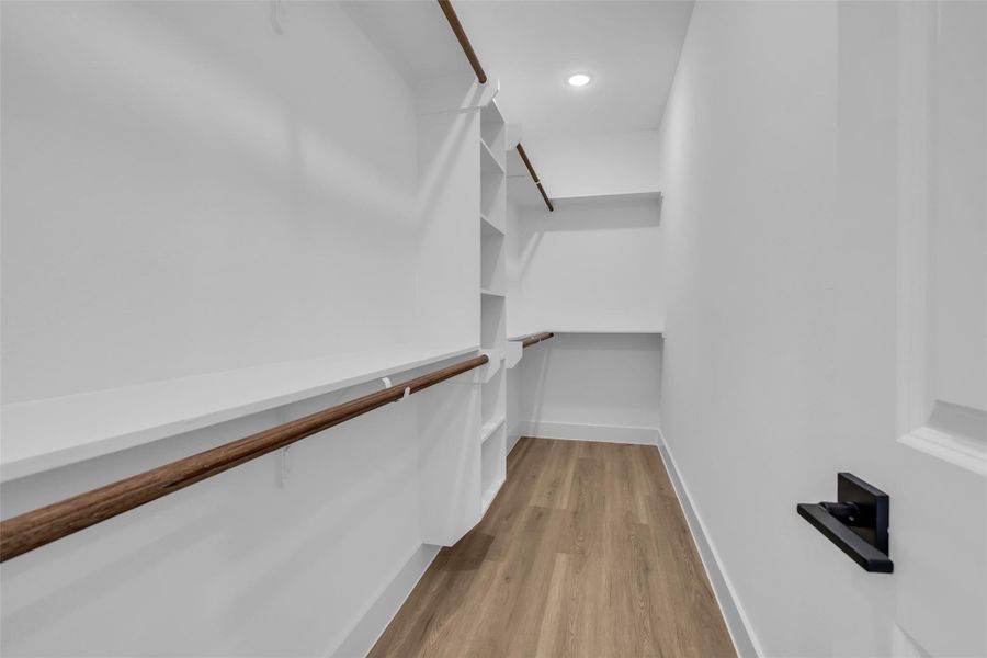 Primary walk-in closet Primary walk-in closet