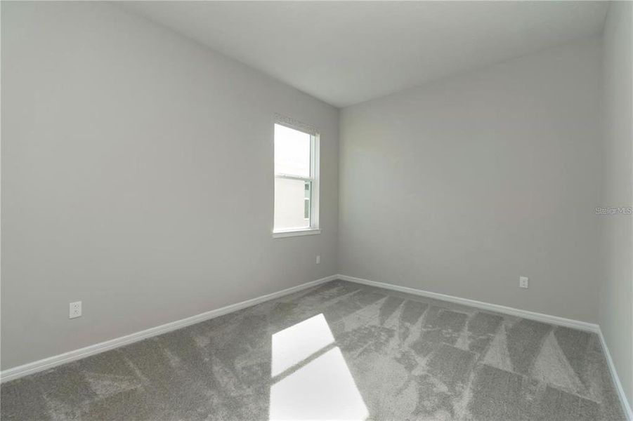 Spacious, unfurnished interior of a new home in Tohoqua Reserve, Kissimmee (Image 22).