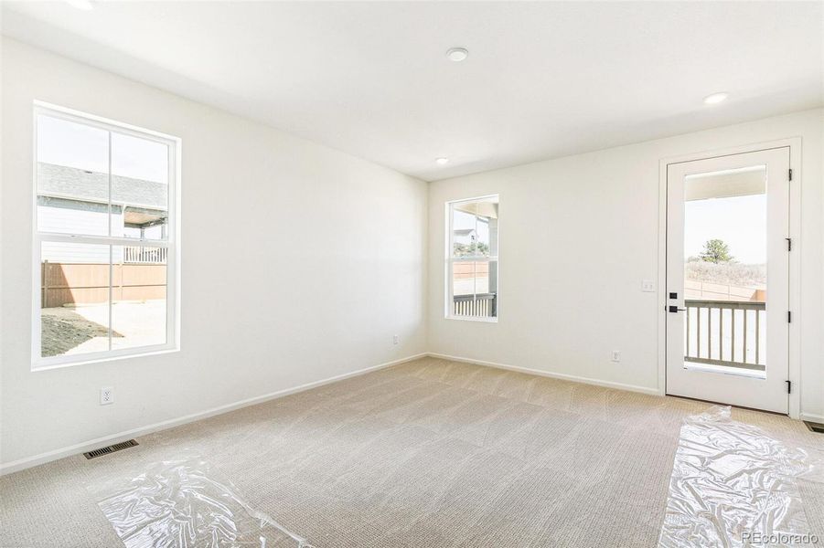 Spacious, unfurnished interior of a new home in Terrain Oak Valley, Castle Rock (Image 35).