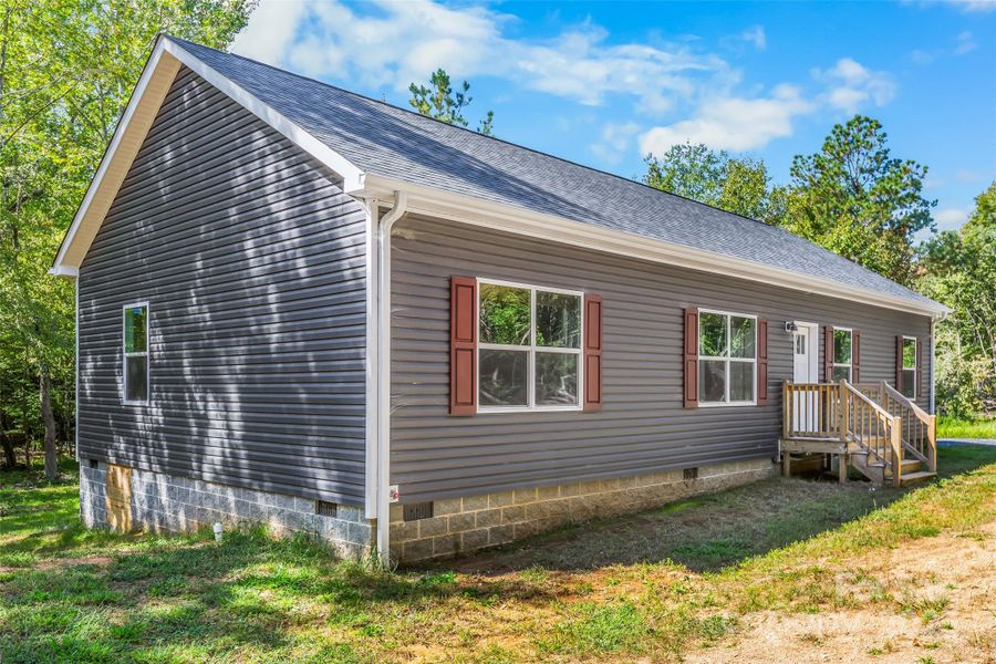 Front exterior of a new home in , New London, NC, highlighting curb appeal (Image 21).