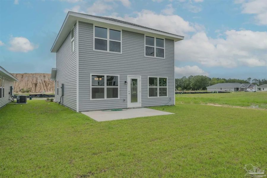 Front exterior of a new home in Westpointe Place, Pensacola, FL, highlighting curb appeal (Image 13).