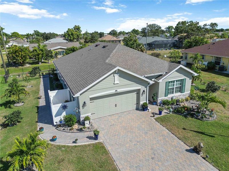 Front exterior of a new home in Burnt Store Village, Punta Gorda, FL, highlighting curb appeal (Image 21).