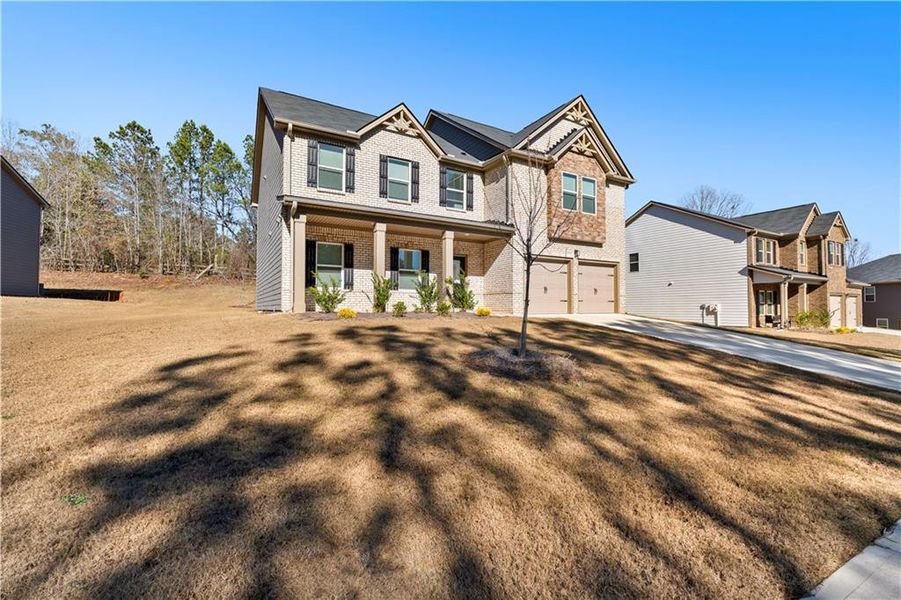 Front exterior of a new home in , Covington, GA, highlighting curb appeal (Image 2). Front exterior of a new home in , Covington, GA, highlighting curb appeal (Image 2).