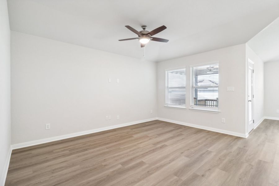 Living room in the Briscoe floorplan at a Meritage Homes community.