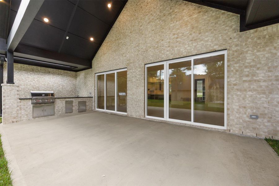 Seamless indoor-outdoor living with expansive sliding glass doors.