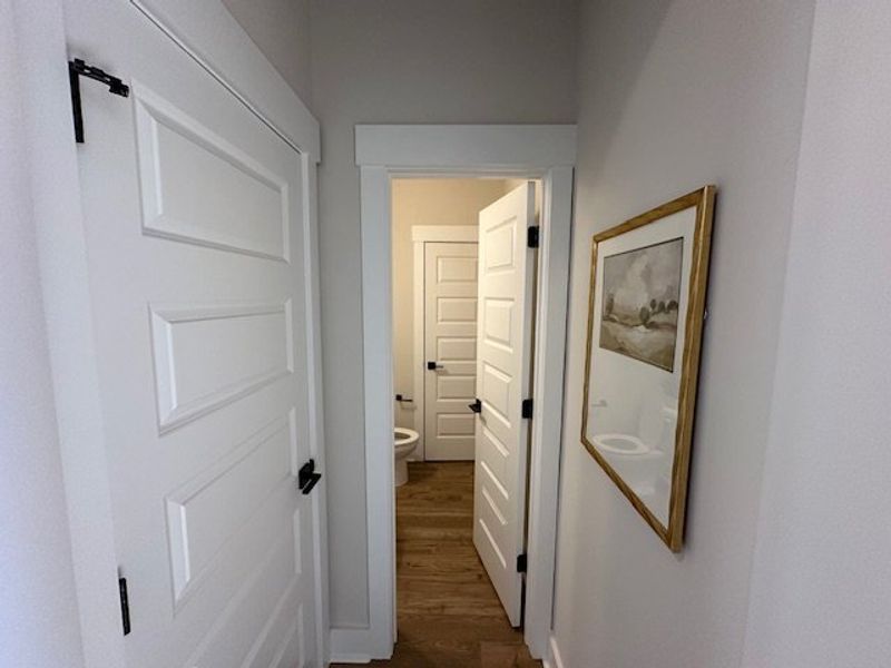 This bright hallway connects various rooms, offeri