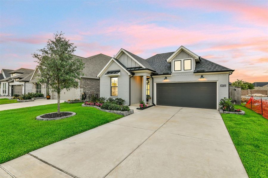 The lush lawn is maintained by full sprinklers. This home is also prewired for solar panels.